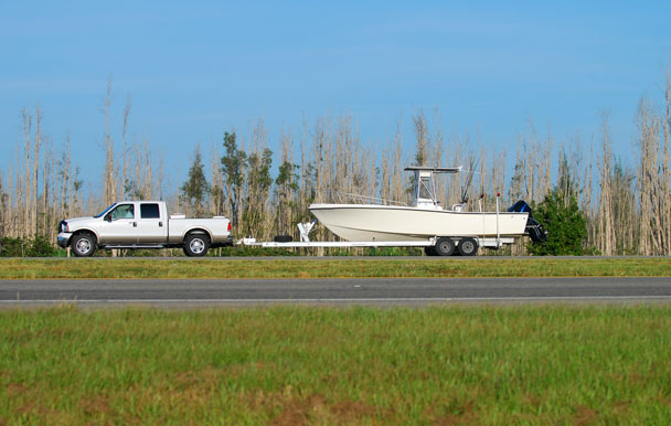 Vehicle towing a trailer with speed limiter